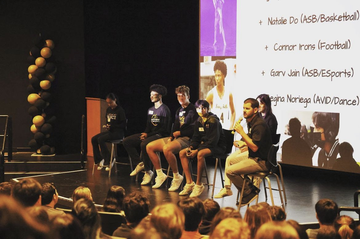Assistant vice principal Peter Karavedas and the student panel reflect on their personal Sunny Hills experiences to an audience of freshmen in the Performing Arts Center Tuesday, July 11.