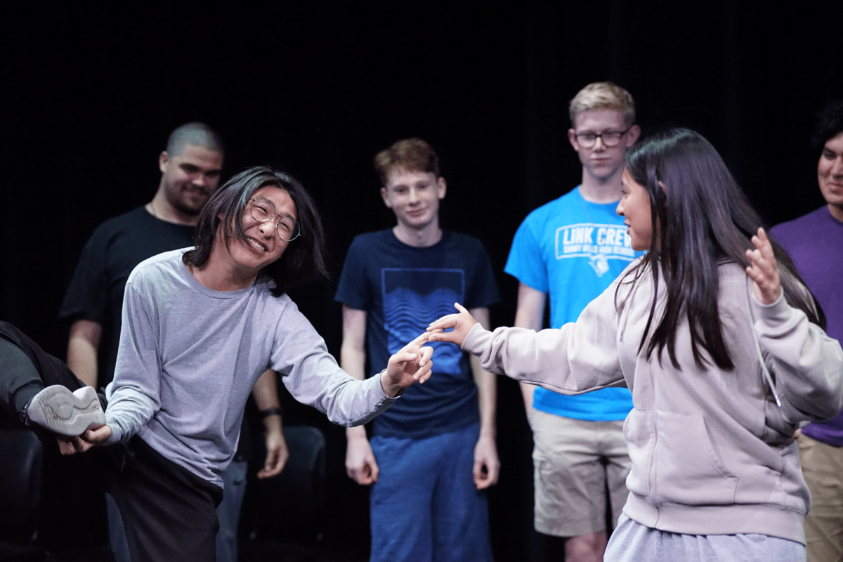 Junior Ian Kim (left) and freshman Celeste Lopez-Garduno (right) rehearse one of their many games, Expert Challenge, on Tuesday, Nov. 8, in the Performing Arts Center.