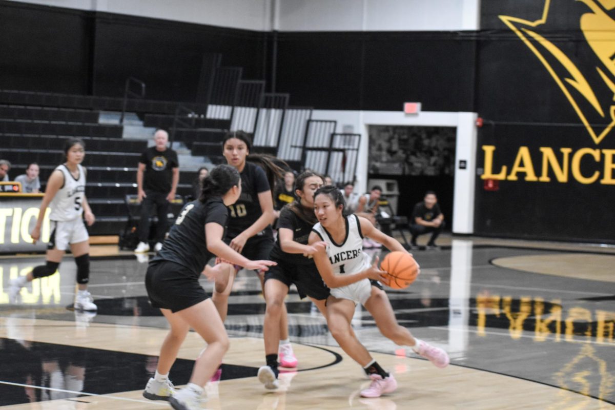 Power forward senior Natalie Do prepares to dribble the ball during an after school practice on Tuesday, Dec. 12, in the Sunny Hills gym. The Lady Lancers will start Freeway League play on Thursday, Dec. 21, at home against the Sonora Raiders. 
