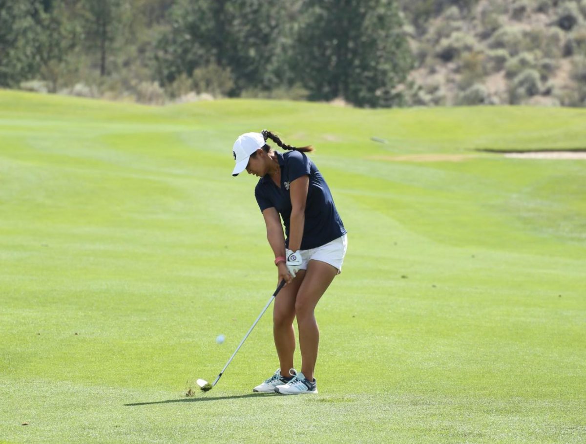Senior Yurang Li swings a golf wedge earlier this summer in the Girls Junior Americas Cup at Nk’Mip Canyon Desert Golf Course in British Columbia, Canada. Li has committed to play for the University of Illinois women’s golf team.
