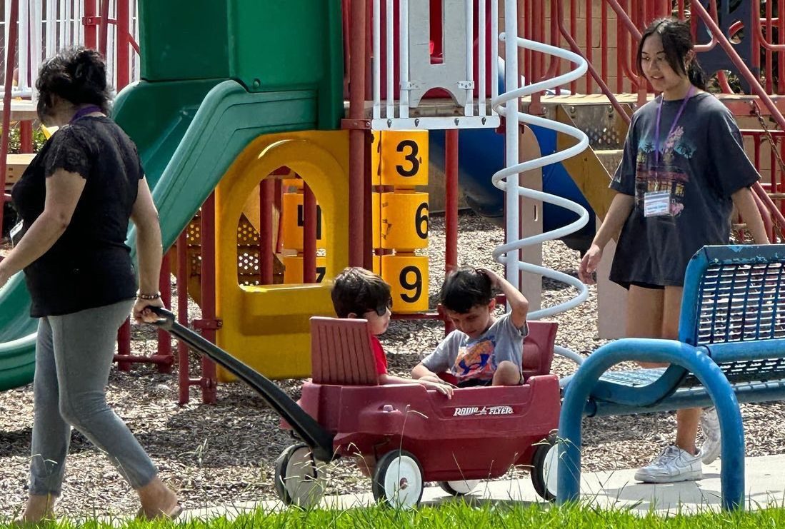 Senior Hannah Garcia (right) supervises two visually impaired children during a Fall Kids Day on Saturday, Sept. 9, at Beyond Blindness outdoor playground in Santa Ana. Garcia was among those from a new Sunny Hills club, Eye Matter, volunteering to help with kids who have a visual disability.