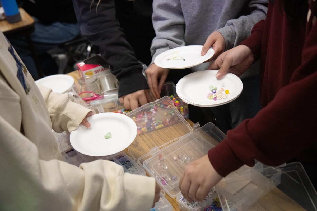 Some members of the Beadology Club gather items to create jewelry during lunch on Friday, Jan. 12. The club has weekly Friday meetings in Room 85; club members can keep their handmade jewelry afterward. 