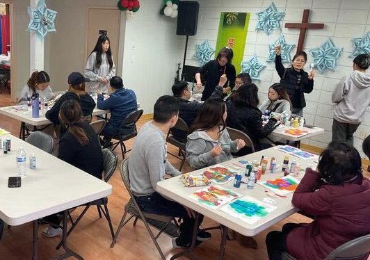 Members of Christian Disability Awareness assist the disabled with arts and crafts at Muldan Garden Disabled Mission Society in Fullerton -- also known as Watered Garden Mission -- on Saturday, Jan. 13.