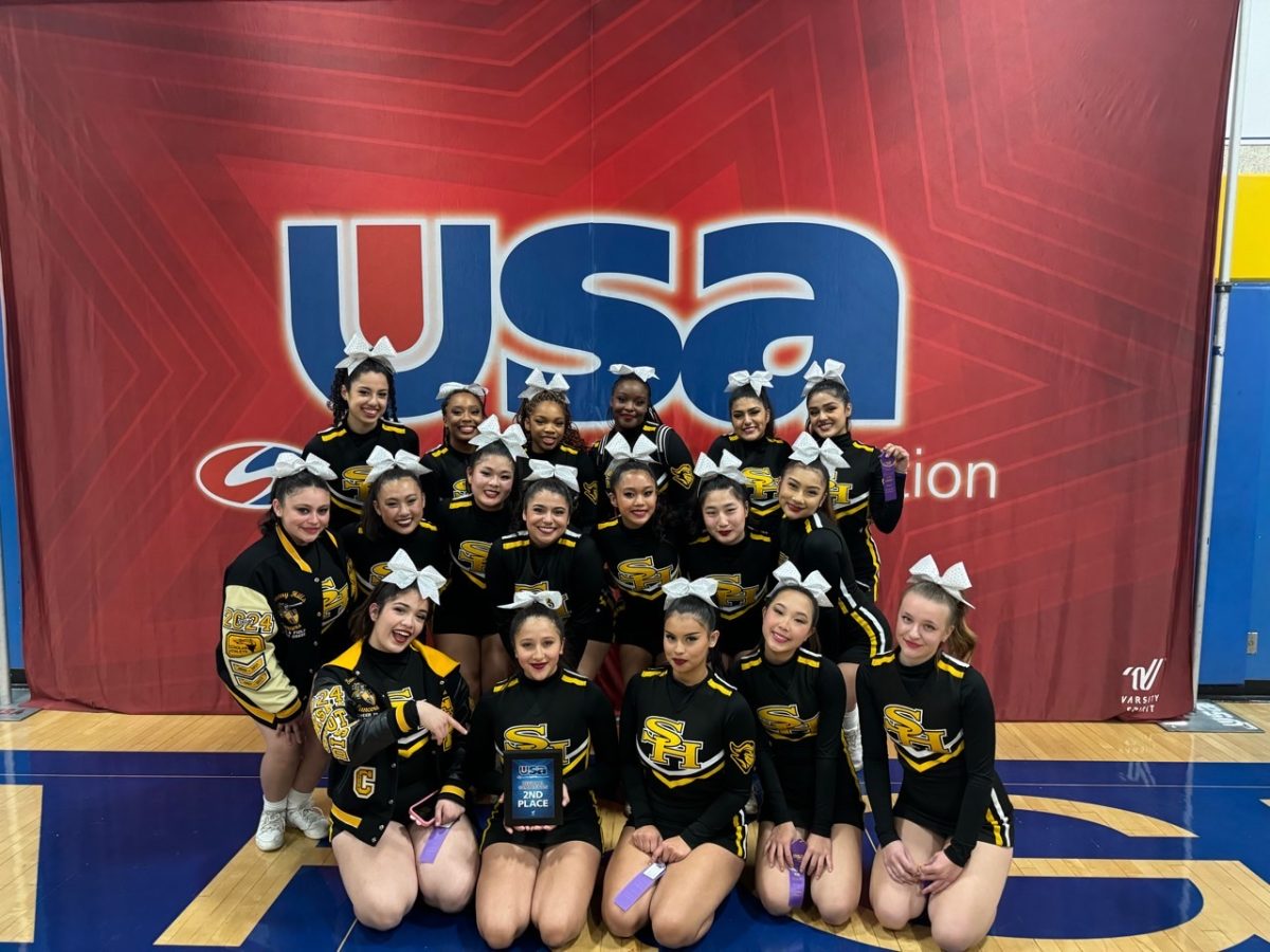 The Lady Lancers – with sophomore Emily Kim in the front row fourth from the left – hold their second-place plaque, qualifying for nationals, from their first cheer competition at Agoura High School on Saturday, Jan. 13.