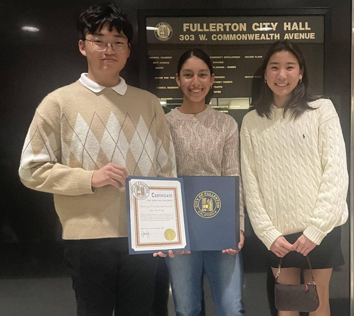 Girls tennis player junior Daniela Borruel (center) is joined by her two Sunny Hills friends whom she had invited to celebrate the certificate she received from the Fullerton City Council in City Hall on Tuesday, Jan. 16.