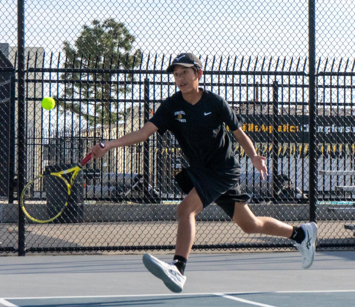 Freshman Dom Tenazas competes in a singles 3 during a home match against Bolsa Grande High School on Tuesday, March 5. Tenazas won 6-8, helping the Lancers to a 14-4 victory. 