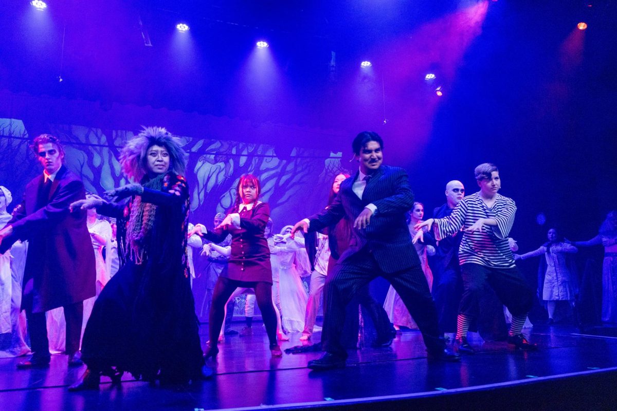 The main cast of “The Addams Family” dances together during the Wednesday, April 3, dress rehearsal in the Performing Arts Center of the musical comedy’s first act intro titled, “When You’re an Addams.”