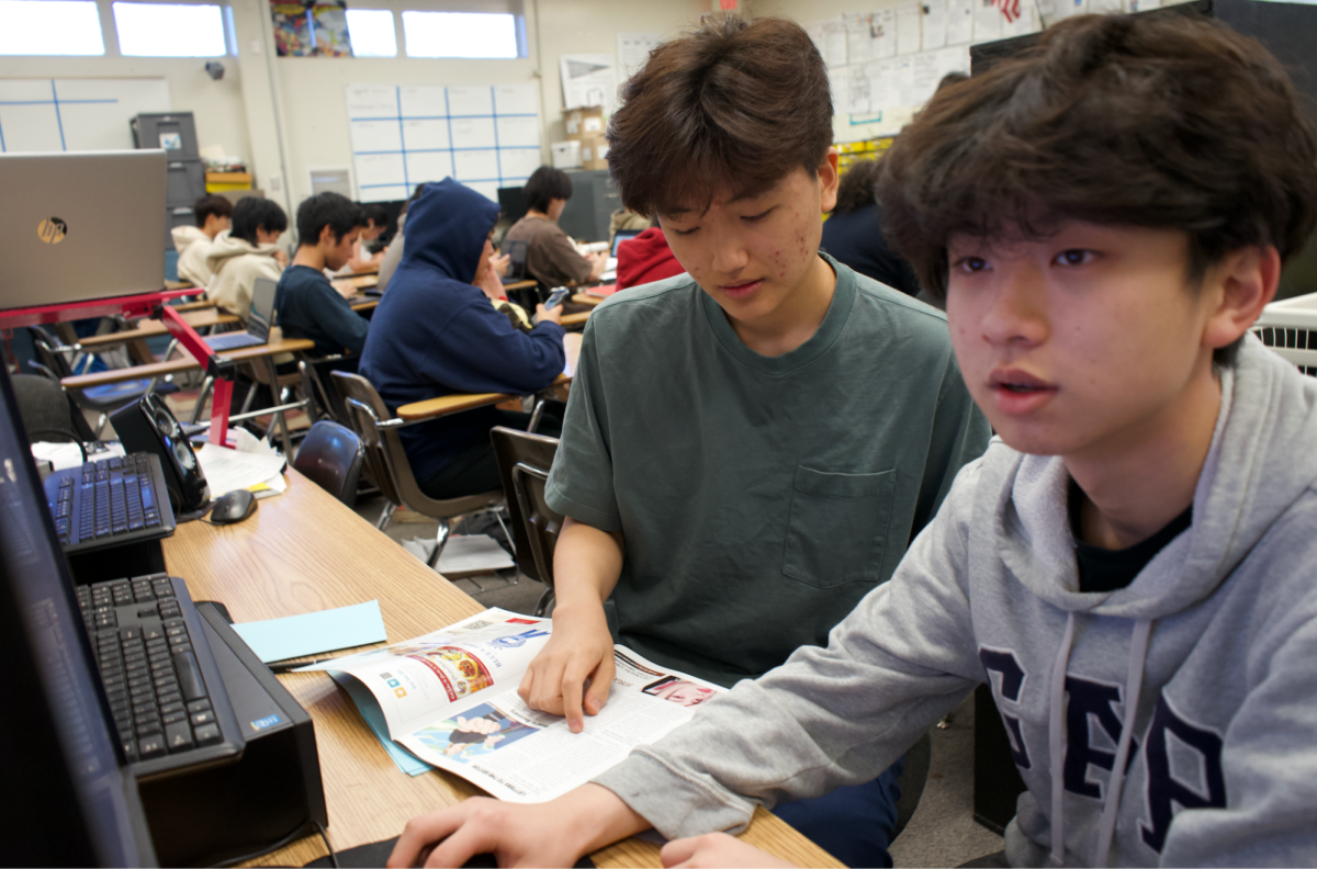 Accolade staff writers junior Kayden Kim (left) and sophomore Kevin Lee work on creating magazine layouts for The Accolade’s upcoming May senior issue during fourth period Tuesday, April 17, in Room 138. With the creation of an honors Advanced Journalism course starting next school year, Kim, Lee and their peers on staff can be eligible to earn honors credit for taking this elective if they become an editor.