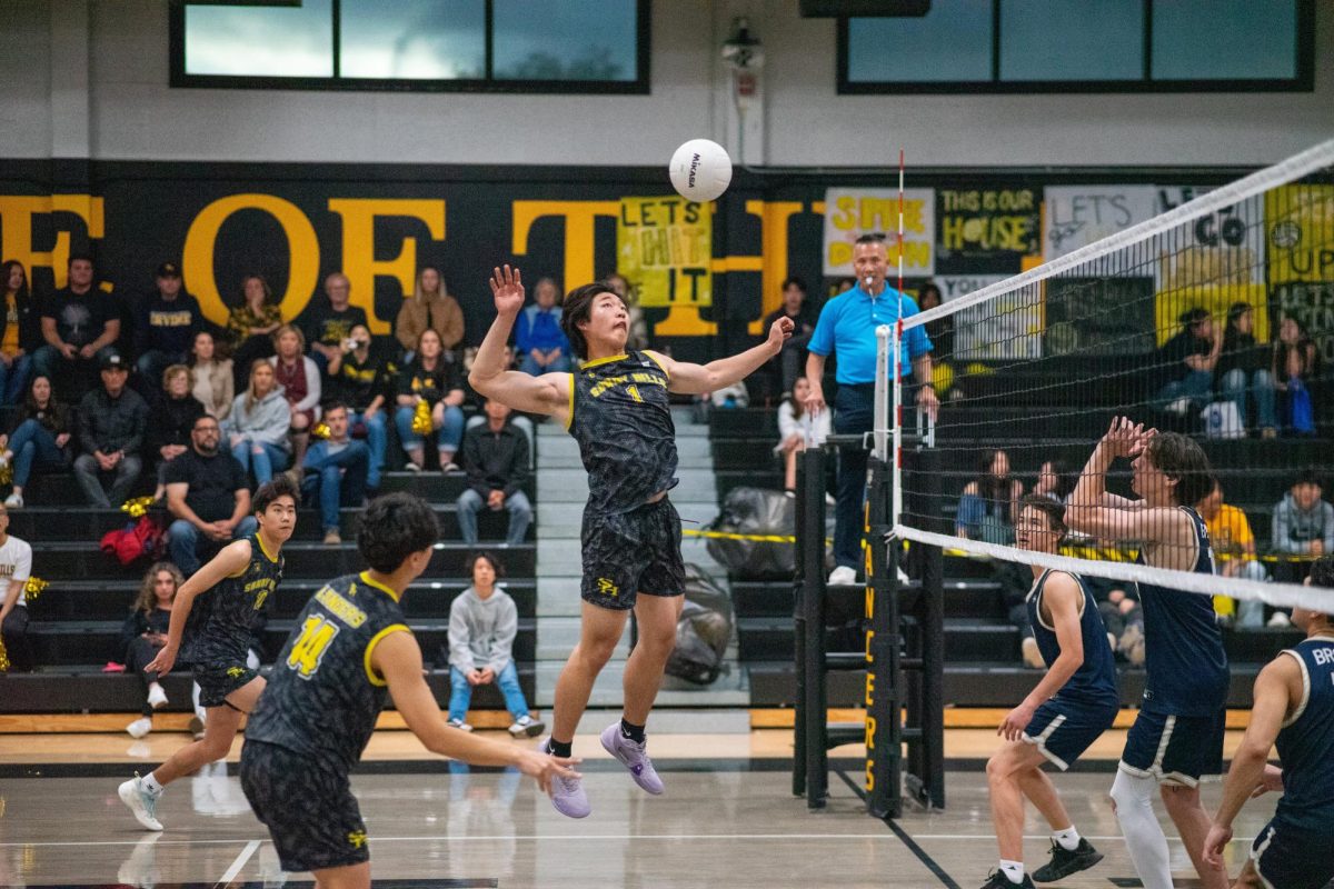 Middle hitter junior Ryan Sunwoo prepares for a kill against the Vista Murrieta Broncos in the SH gym Thursday, April 25. The Lancers won their first round of CIF after winning three of the four sets and will play their second round Saturday, April 27, at an away game against the El Dorado Hawks. 
