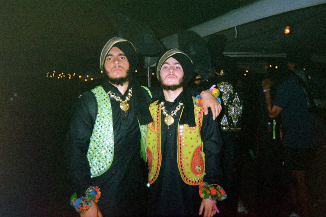 Senior Bhajneek Anand (right) poses next to his brother sophomore Manveer Anand on Saturday, April 22, in Indio, California for the second week of Coachella 2023.