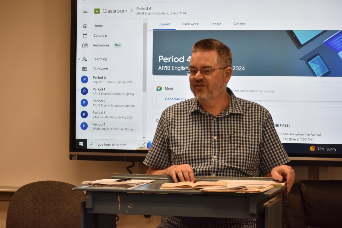 English teacher Tom Wiegman discusses Arthur Miller’s play, Death of a Salesman, with his fourth-period Advanced Placement English Literature and Composition class Wednesday, April 3, in Room 14. Wiegman will retire after 35 years here.