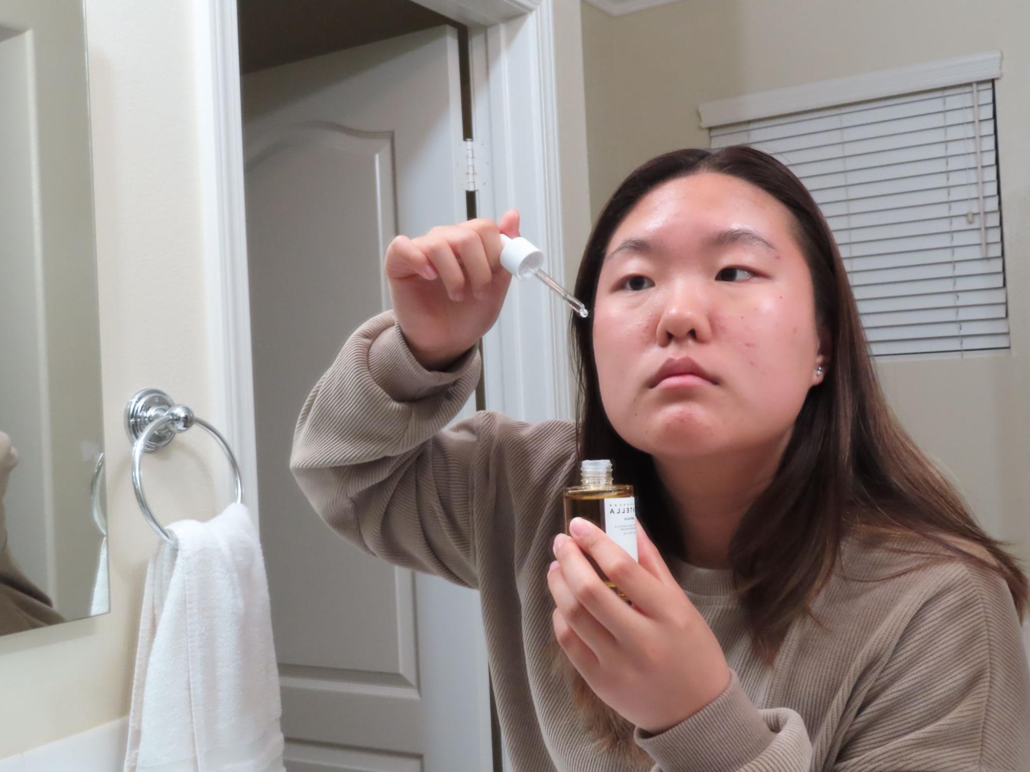 Accolade copy editor sophomore Nicole Park applies her newly bought skincare ampoule after being influenced to purchase it by various TikTok and Instagram influencers.