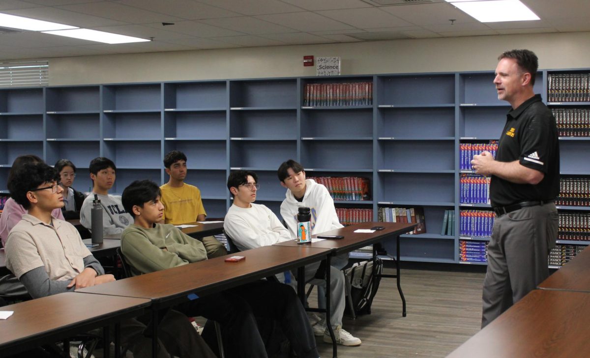 Valedictorians+sit+in+the+library+during+first+period+on+Monday%2C+April+15%2C+as+they+listen+to+principal+Craig+Weinreich+talk+about+how+the+graduation+speech+candidates+will+be+chosen.