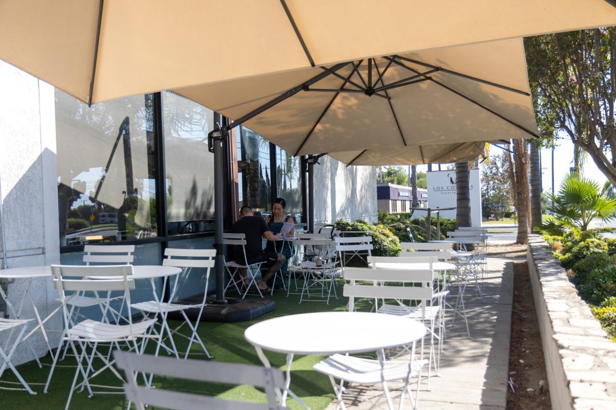 Two customers at Stereoscope sit at the cafe’s outside patio on Wednesday, Sept. 4. 