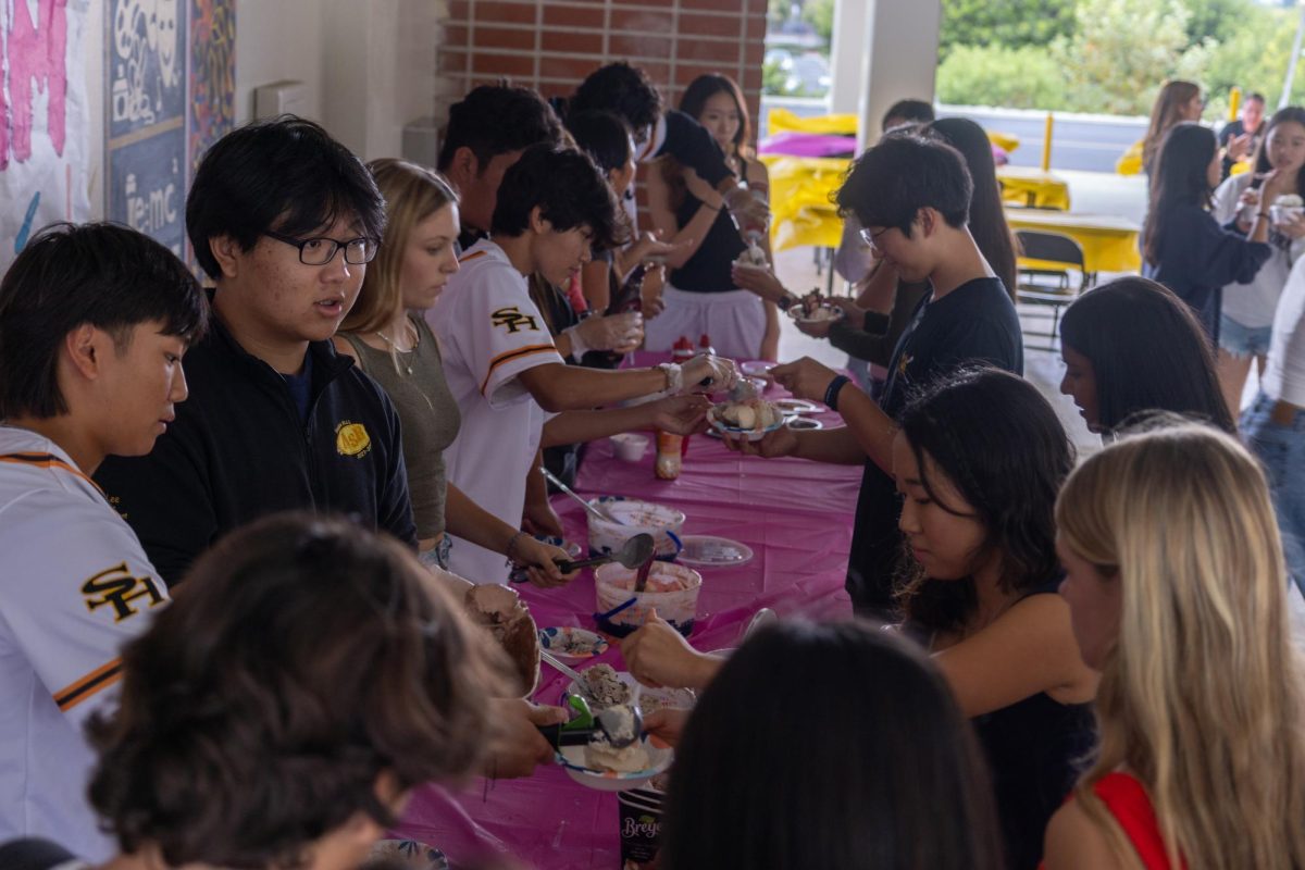 ASB students (left) scoop various ice cream flavors for students from their program during lunch on Friday, Sept. 20.