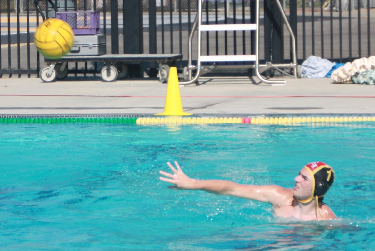 Goalie freshman Thomas Rovira throws the ball to a teammate during a Thursday, Aug. 29, home game against Segerstrom at the Sunny Hills pool.