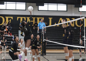 Opposite hitter senior Dylyn Williams tips the ball during the home match against Mary Star of the Sea High School on Friday, Aug. 30. The Lady Lancers won in straight sets.