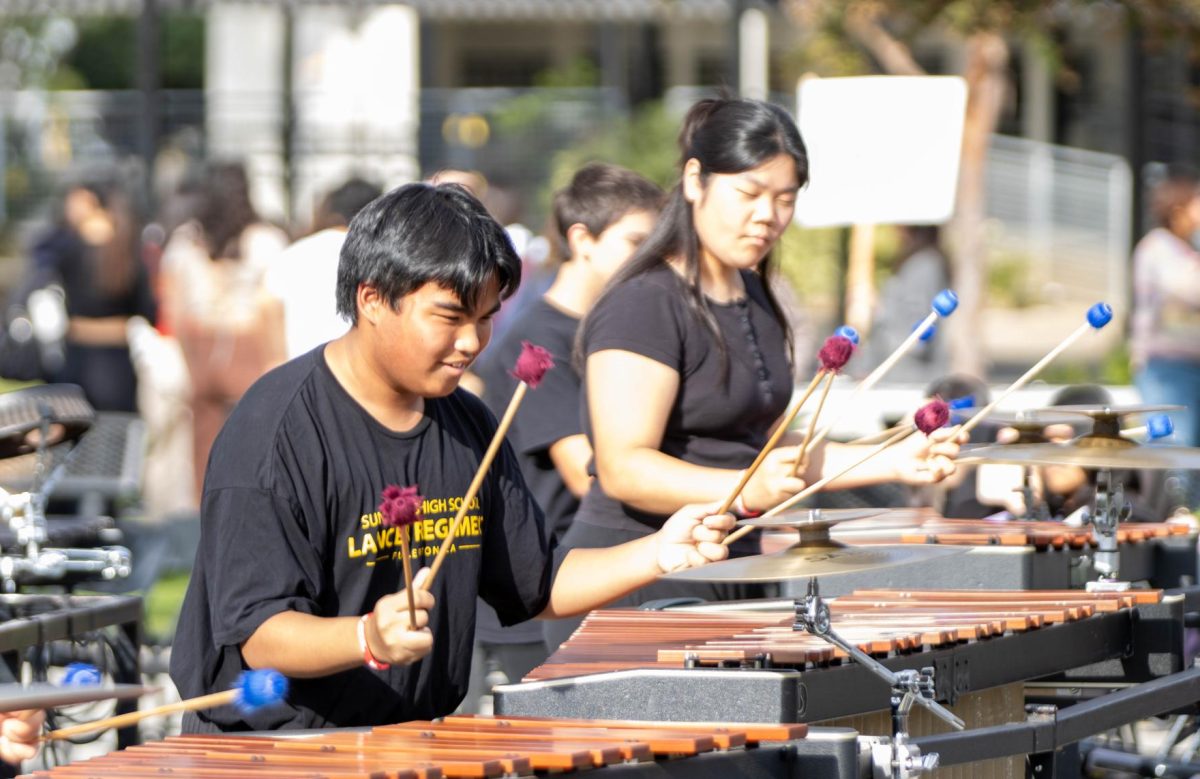 Lancer Regiment members senior Carlos Pineda (left) and then-senior Olive Hong perform the "Cirque Noir" on their marimbas during the Conservatory of Fine Arts Fall Festival on Oct. 25, 2023. The Regiment will return to the quad to perform after school in this year's event on Wednesday,, Oct. 30, the day before Halloween.