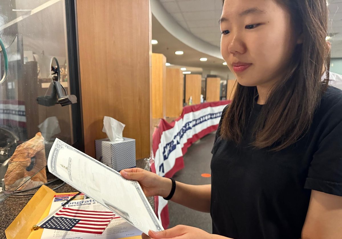 Accolade web editor-in-chief senior Seowon Han receives her Certificate of Naturalization at the U.S. Citizenship and Immigration Services in Santa Ana after the taking the Oath of Allegiance on Monday, Sept. 23.