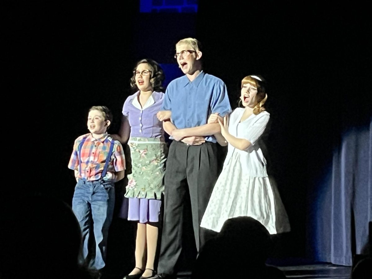 Senior Caleb Van Hook (center) and to his left, his younger sister -- sophomore Kensie -- along with two other "Bye Bye Birdie" cast members sing "Hymn for a Sunday Evening" Sunday, Nov. 10, at Hope International University in Fullerton. The Van Hooks and their cast mates will perform in the same comedy-musical again this weekend on Friday, Nov. 15, and Saturday, Nov. 16, at the same venue.