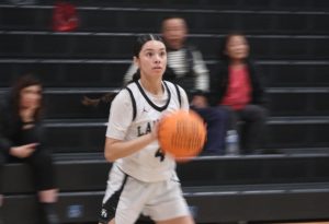 Power forward and co-captain junior Arianna Holguin gets ready to shoot the ball during a Thursday, Dec. 19, girls basketball game in the Sunny Hills gym against the Woodbridge Warriors.