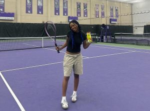 Senior Lillian Foster poses with a tennis racket and balls at Northwestern’s tennis court on Monday, July 8, during the Northwestern pre-college program from Sunday, June 30-Saturday, July 13.