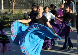 Latinx club member senior Sarah Patino spreads out her skirt while performing the Jalisco dance in the quad on Wednesday, Jan. 15. Patino will be among seven cultural clubs performing in the gym for the first time in front of parents and others on the eve of the Friday, Feb. 7, International Week assembly.