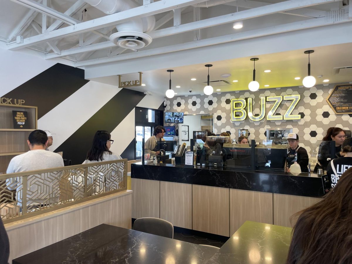 Workers stand behind the bar on a visit to Better Buzz Coffee in Fullerton on Saturday, Jan. 18.