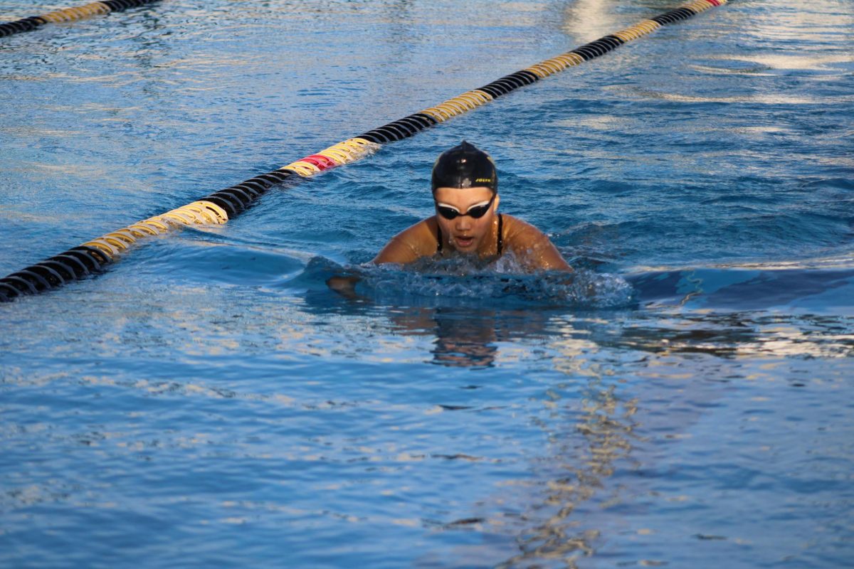 Senior Ellie Kwak swims the 200 Individual Medley during the team time trials on Wednesday, Feb. 19, after school in the Sunny Hills pool.