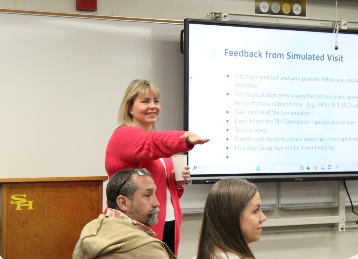 Sunny Hills staff, parents and students listen to English teacher Suzanne Boxdorfer who is standing in front of the podium to present accreditation information in Room 33 on Wednesday, March 5.