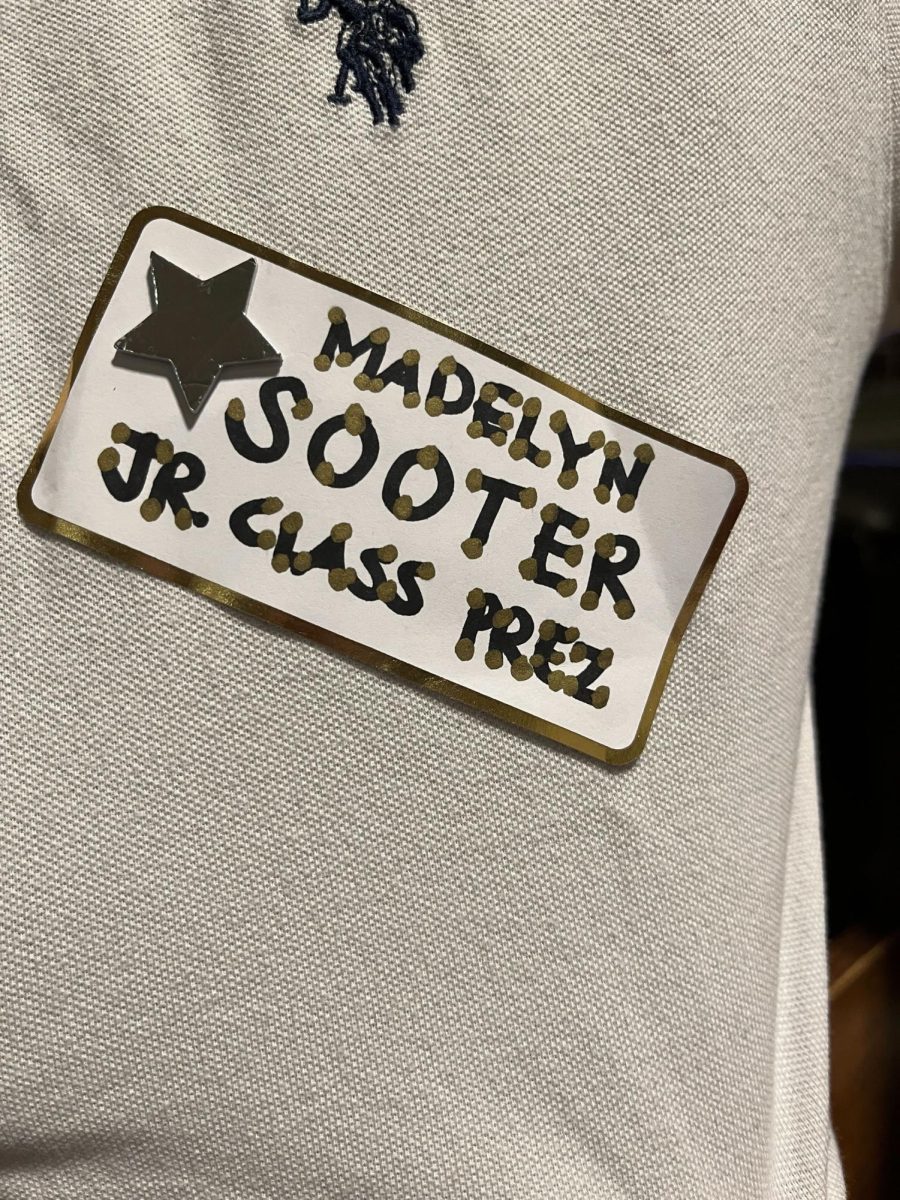 One of the stickers found on a student's clothing item to support a student running for a class officer position. While most prefer to run their campaign via social media nowadays, sophomore Madelyn Sooter decided to pass out hard copies of her campaign for junior class president upon a suggestion from her mother, who when she was in high school did something similar in her bid for an elected cabinet position. (Image taken by Tommy Li)