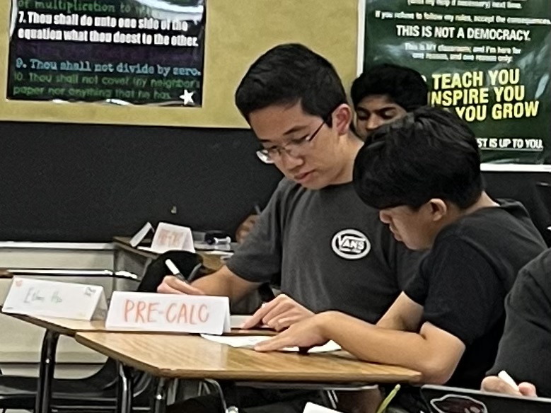 Algebra Center tutor then-junior Ethan Hsu helps a student with their math homework after school in Room 45 on Sept. 5, 2023. (Image taken by Seowon Han)