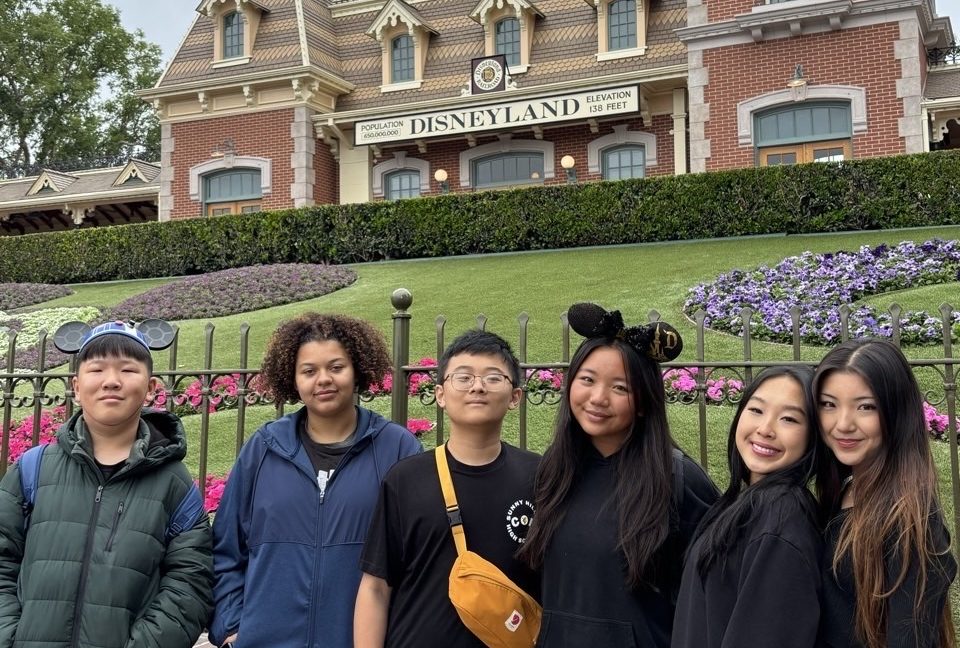 Members of the Circle of Friends club stand in front of Disneyland on Wednesday, April 30, during their end-of-year field trip to the amusement park.