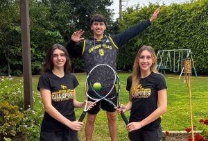 Sisters and doubles tennis partners seniors Hannah Saab (left) and Karina Saab hold their rackets while brother senior Lucas Saab prepares for a volleyball spike.