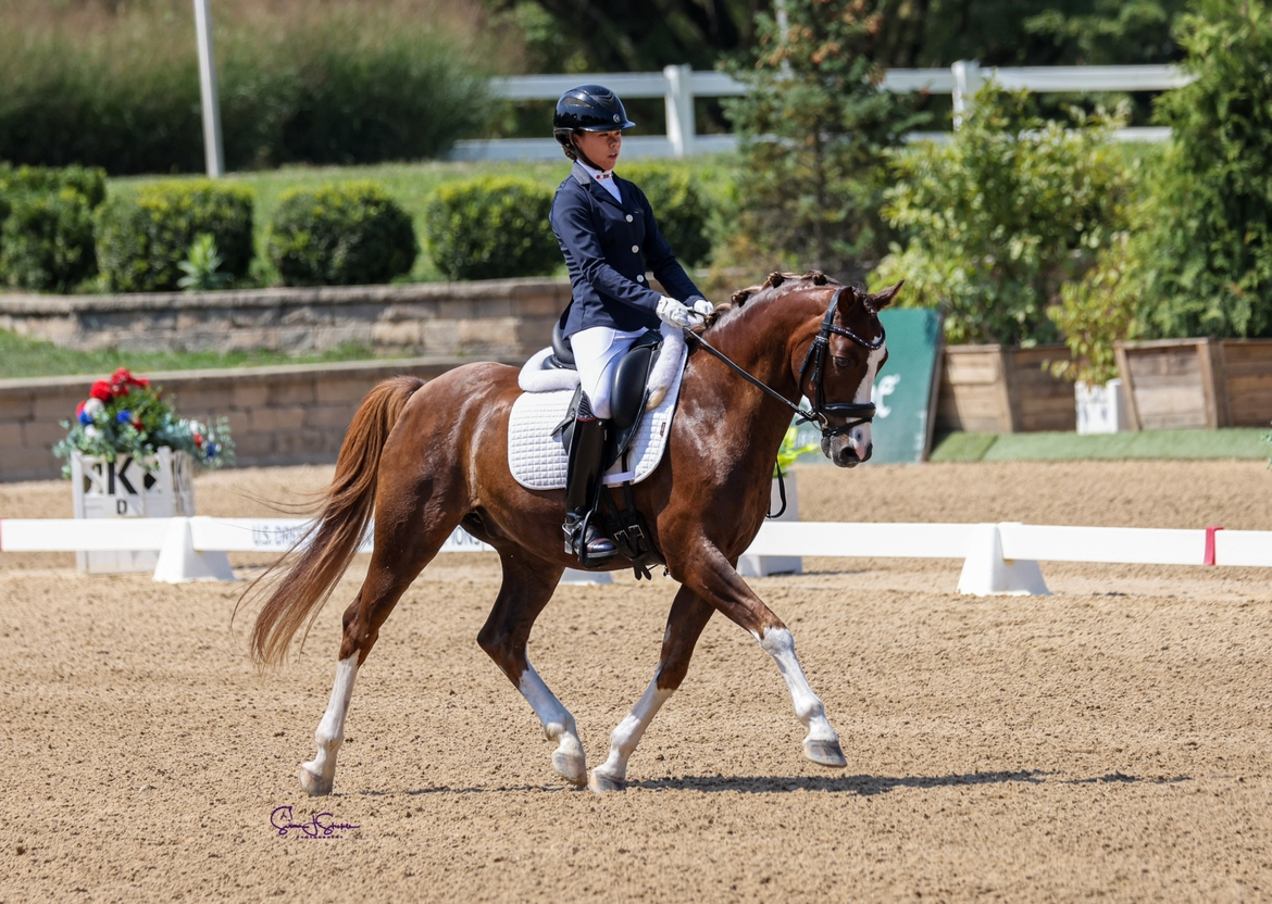 Junior Mia Folk rides on Parco during an equestrian competition Aug. 24 in Chicago, where Folk ended up winning first place in the junior division.