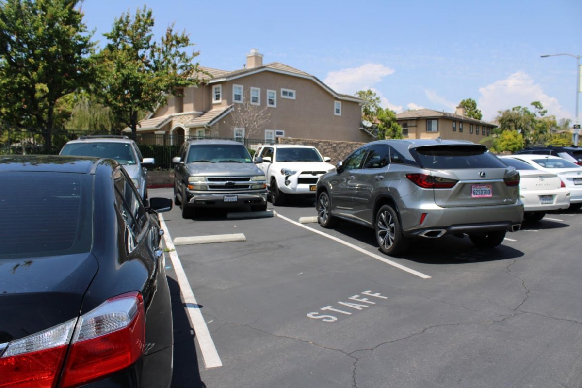 Only one staff parking space remains unoccupied at the end of lunch on Thursday, May 1, in the west parking lot; the other slots have been filled up mainly by student motorists, a violation of school policy. Many have chosen to ignore school rules and park wherever it’s convenient for them, claiming student-marked locations are full.