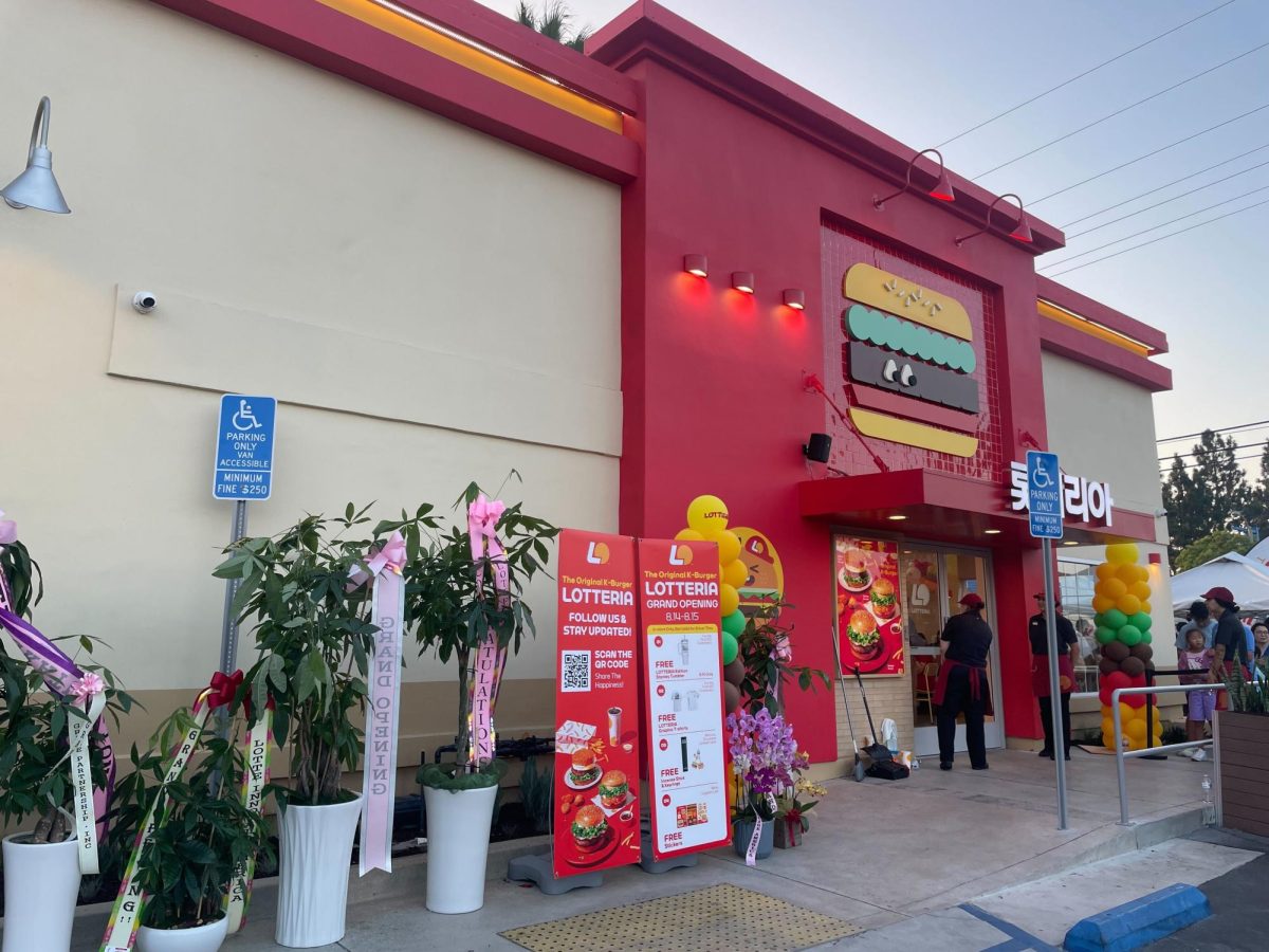 Lotteria employees welcome customers at the Fullerton location, with potted plants, signs and balloons celebrating their grand opening, on Thursday, Aug. 14.