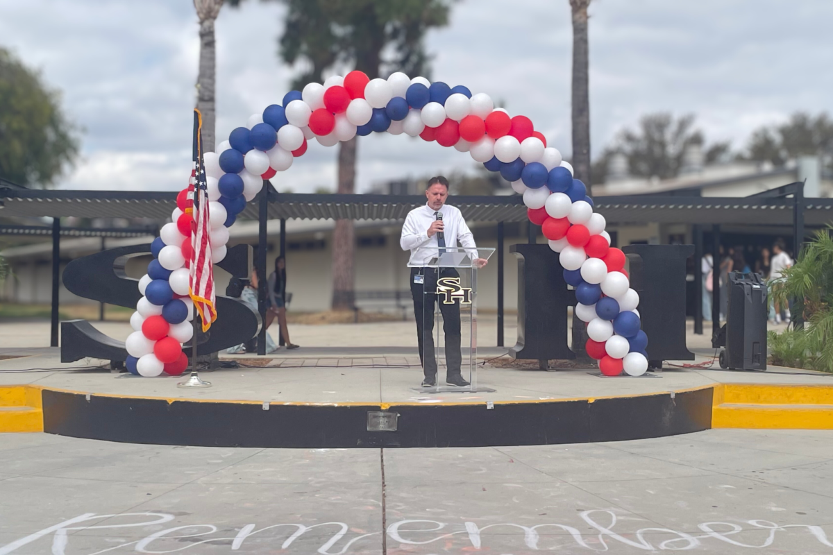Principal Craig Weinreich delivers a speech to remember the lives lost from the 2001 terrorist attacks during the Patriot Memorial Celebration on Thursday, Sept. 11 at break, in the quad.