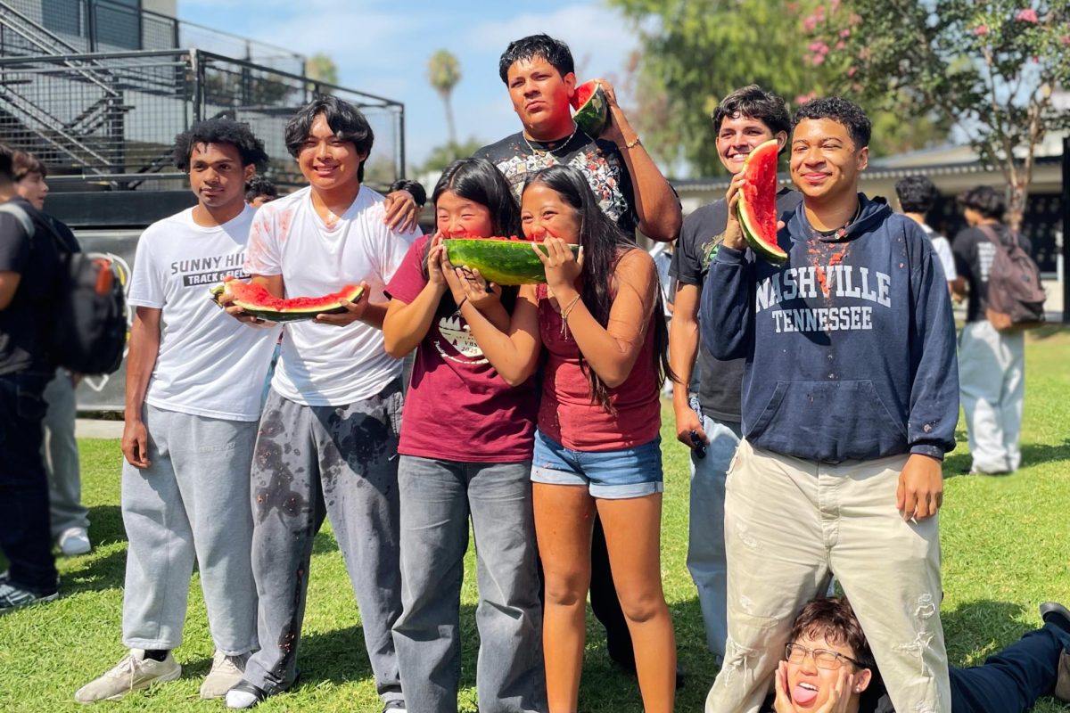 Sunny Hills classes competed in a watermelon eating race during break on Tuesday, Aug 26, in the quad. Posing with their finished watermelons are seniors Rudy Alvizo and Joshua Garcia, juniors Travis McCovery and Zach Song, sophomores Caleb Kang and Dordan Raddatz and freshman Gianna Mikaila De La Cruz and Emma Daae Kim.