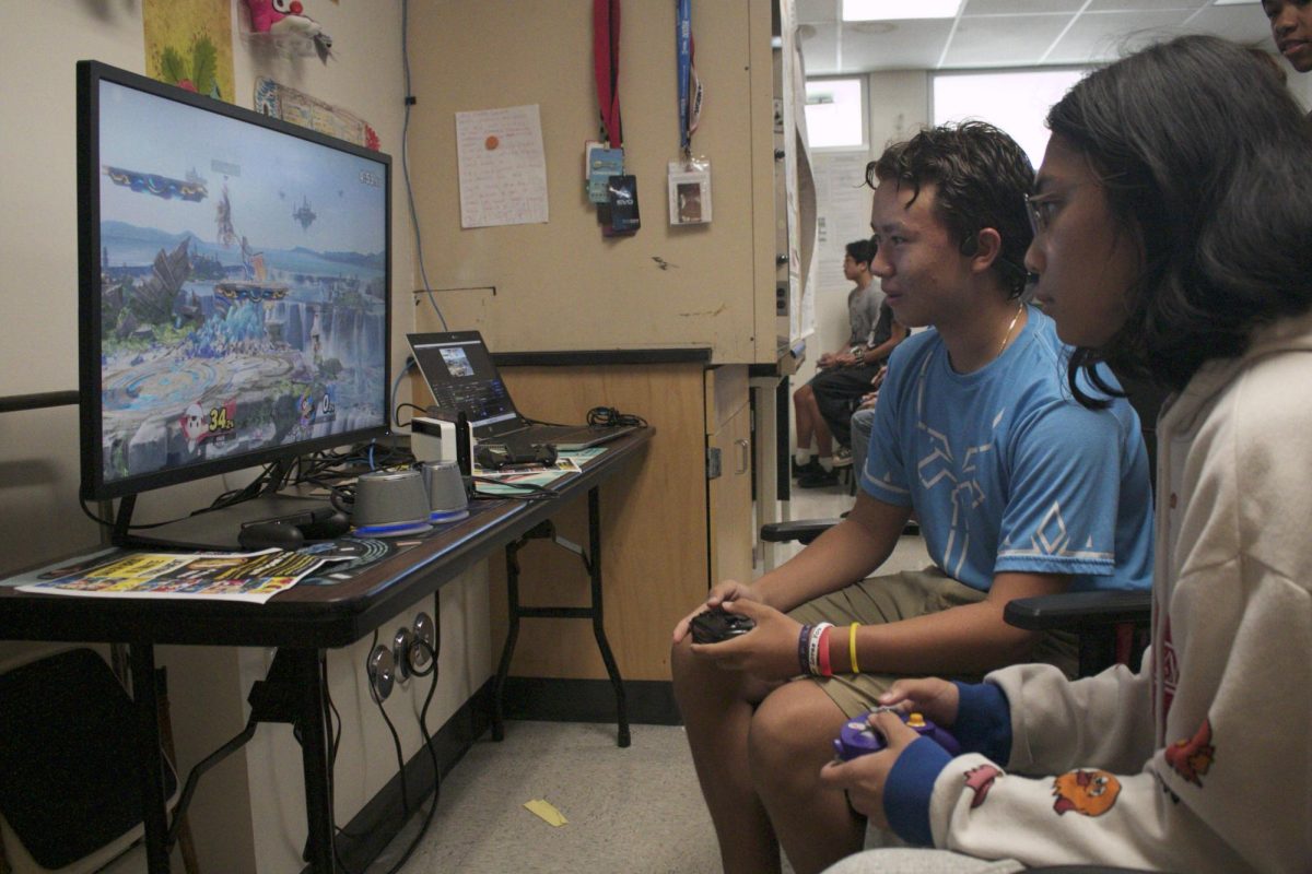 Freshman Brian Nguyen (left) and senior Joseph Loyola (right) compete in Super Smash Bros. during the Smash Bros Ultimate Tournament in Room 111 on Thursday, Sept. 4.