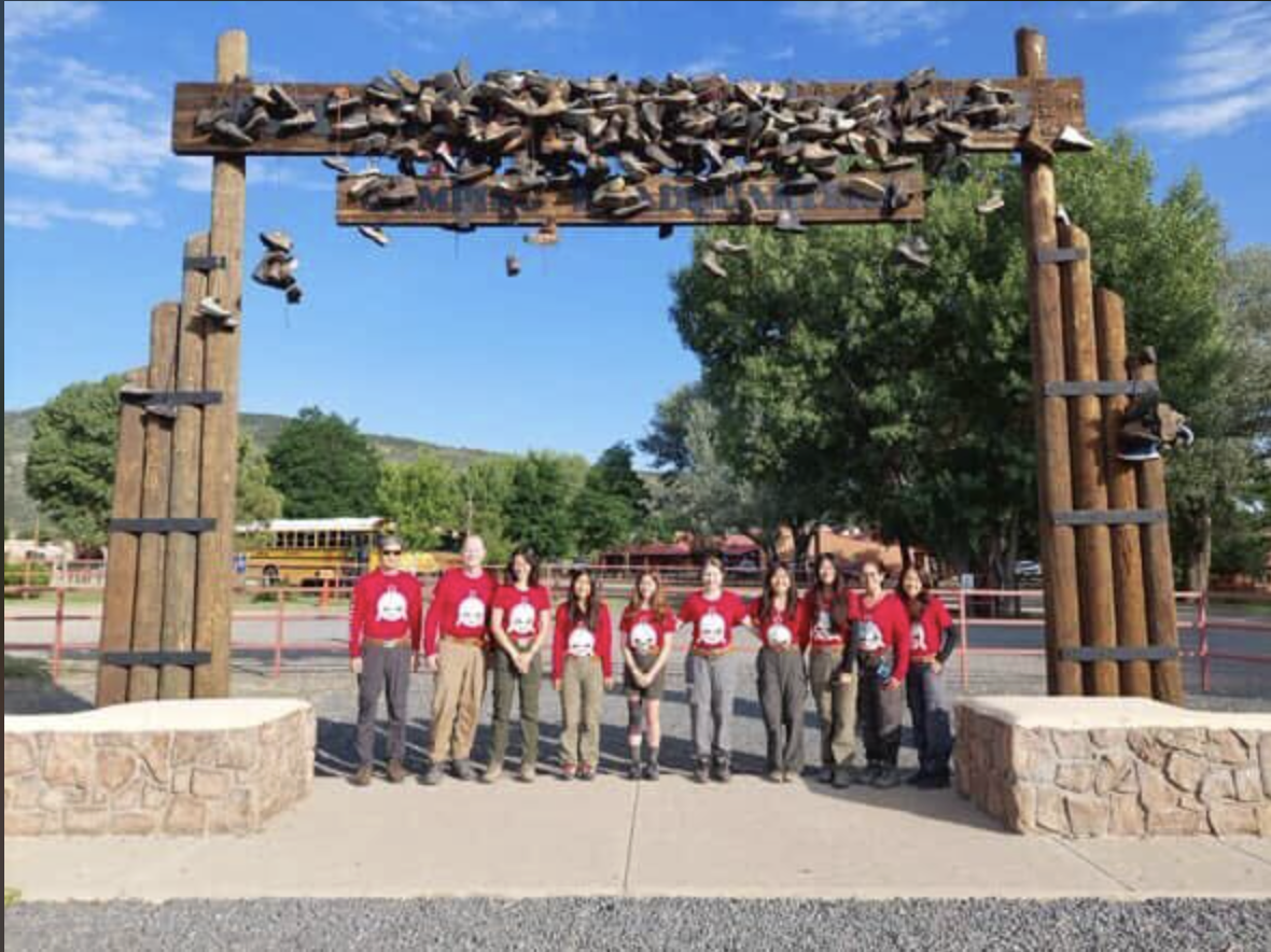 Freshman Jolie Michaels and her scout troop, Troop 1238, prepare for their journey at the entrance of Phlimont.
