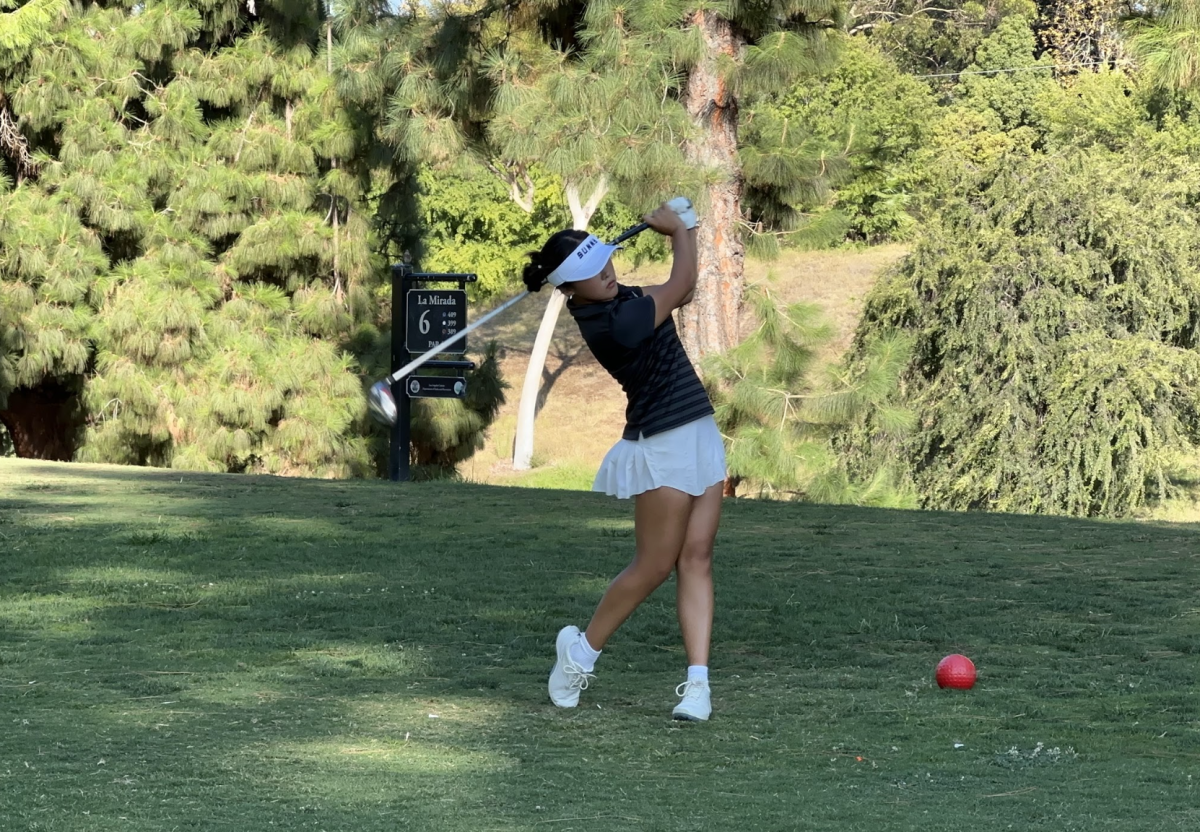 Varsity girls golf player then-junior Jaelyn Yeon hits a golf ball at the golf match against California High School held after school on Thursday, Aug. 29 of the 2024-2025 school year, at the La Mirada golf course.