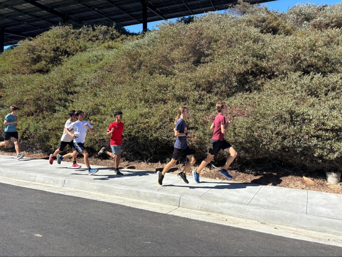 SH cross country athletes begin their run from Lancer Way as they start their pre-race route on Monday, Sept. 8.
