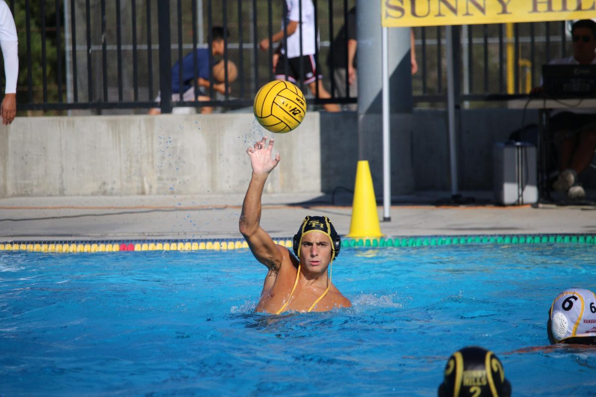 Utility player senior Dante Gelles passes to a teammate during a home game against El Modena High School on Tuesday, Sept. 30, after school at the pool. The final score was 11-10, with the Lancers victorious.
