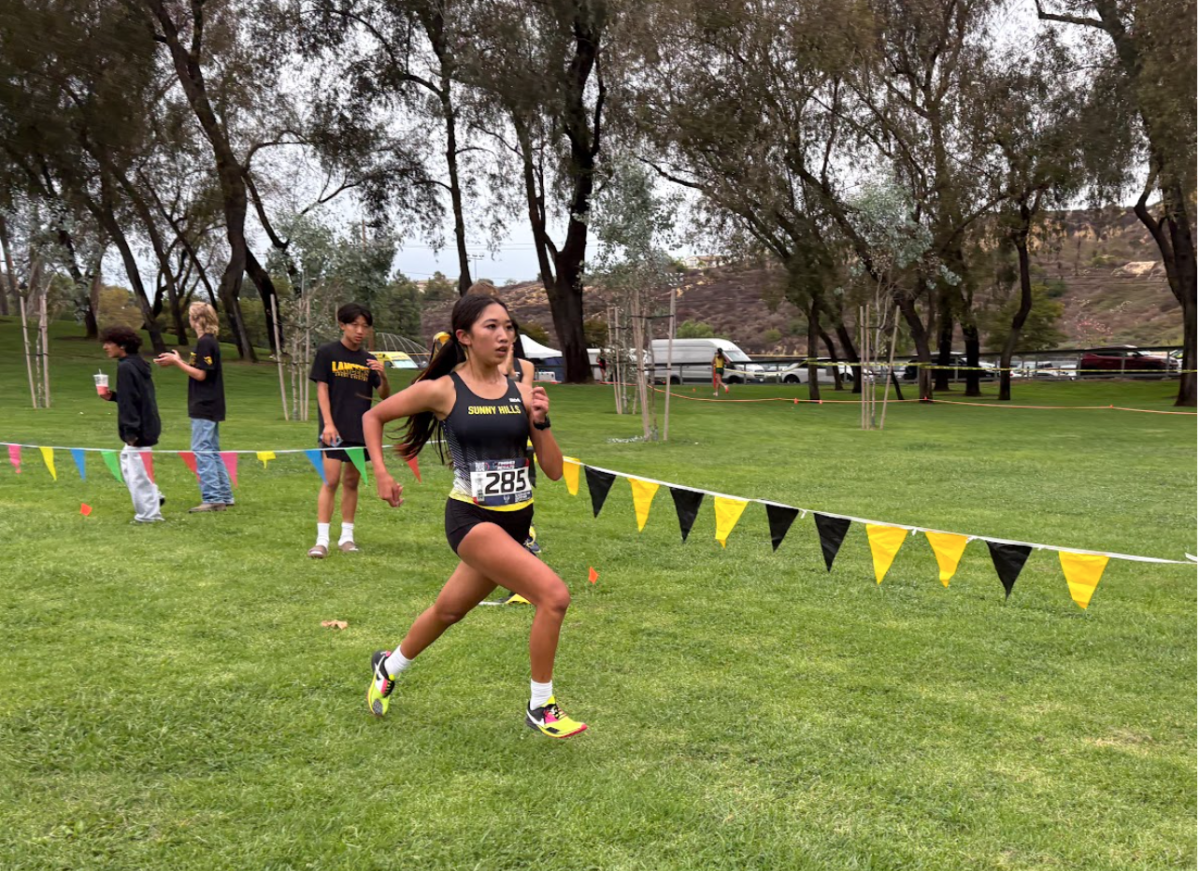 With a strong lead, senior Mia Gonzales runs to the finish line to end her 3.1-mile race, scoring a first-place medal at the 31st Wayne Walker XC Invitational on Friday, Sept. 26.