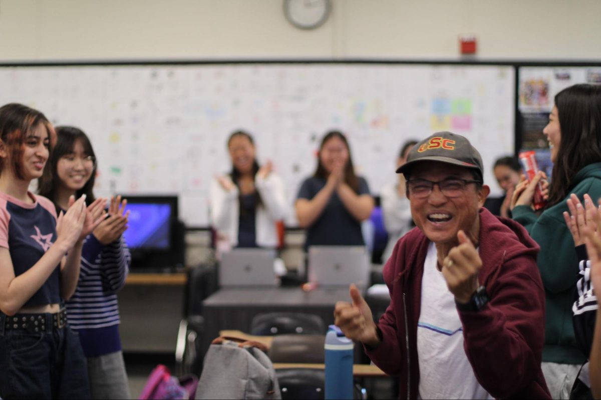Former Accolade adviser Tommy Li leads the Accolade chant in Room 138 on Thursday, Sept. 11, to celebrate the staff’s Pacemaker finalist nomination for their 2024-2025 newsmagazines. 