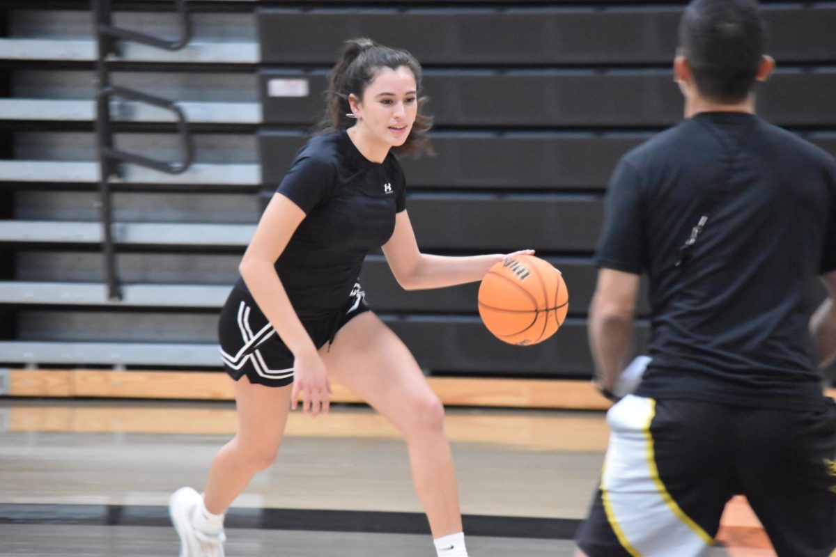 Senior center Noehlia Reuter dribbles during practice on Wednesday, Dec. 17, at the Sunny Hills gym. 