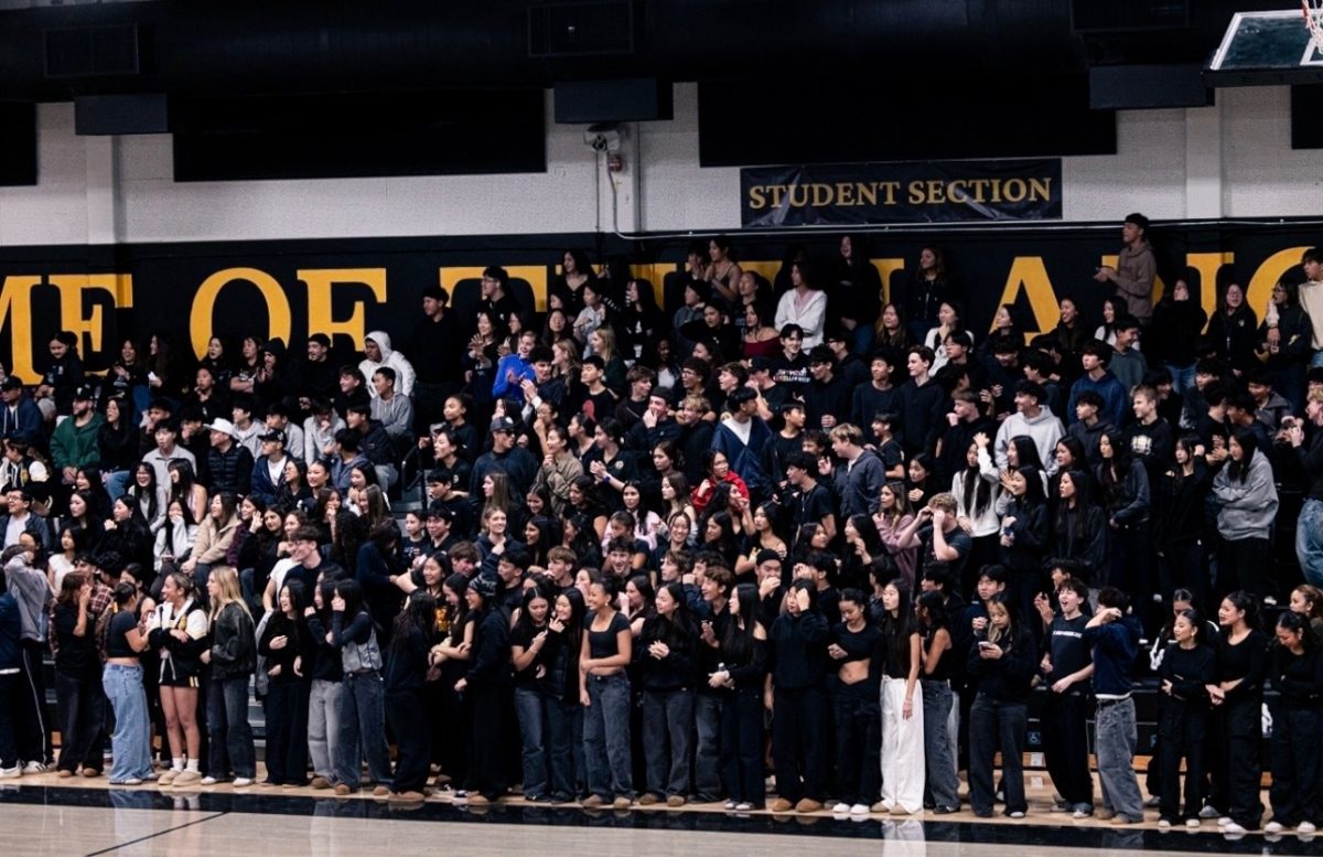 Middle school students fill the student section during the Boys Basketball game at the Sunny Hills gym on Friday, Jan. 9 for Future Lancer Night.
