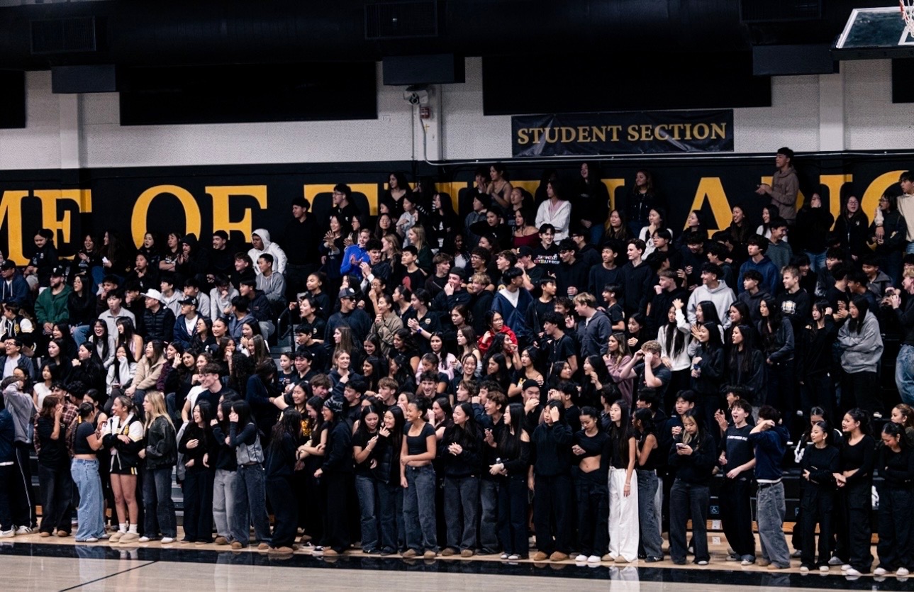 Middle school students fill the student section during the Boys Basketball game at the Sunny Hills gym on Friday, Jan. 9 for Future Lancer Night.