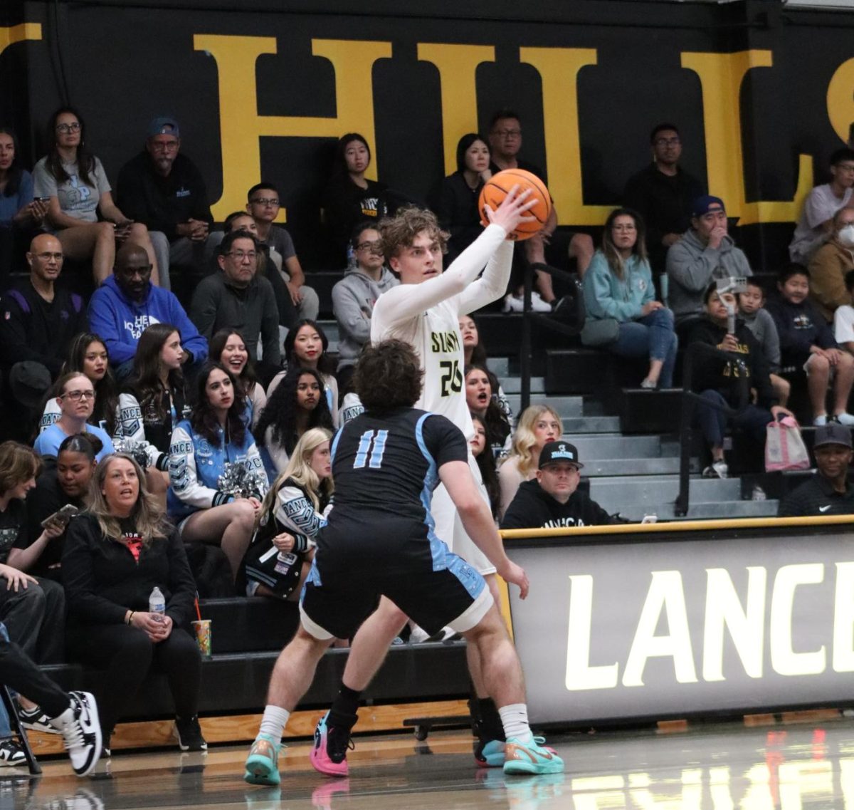 Forward senior Micah Cowell takes hold of the ball in the second half of the home game against the Villa Park Spartans on Tuesday, Feb. 3. 